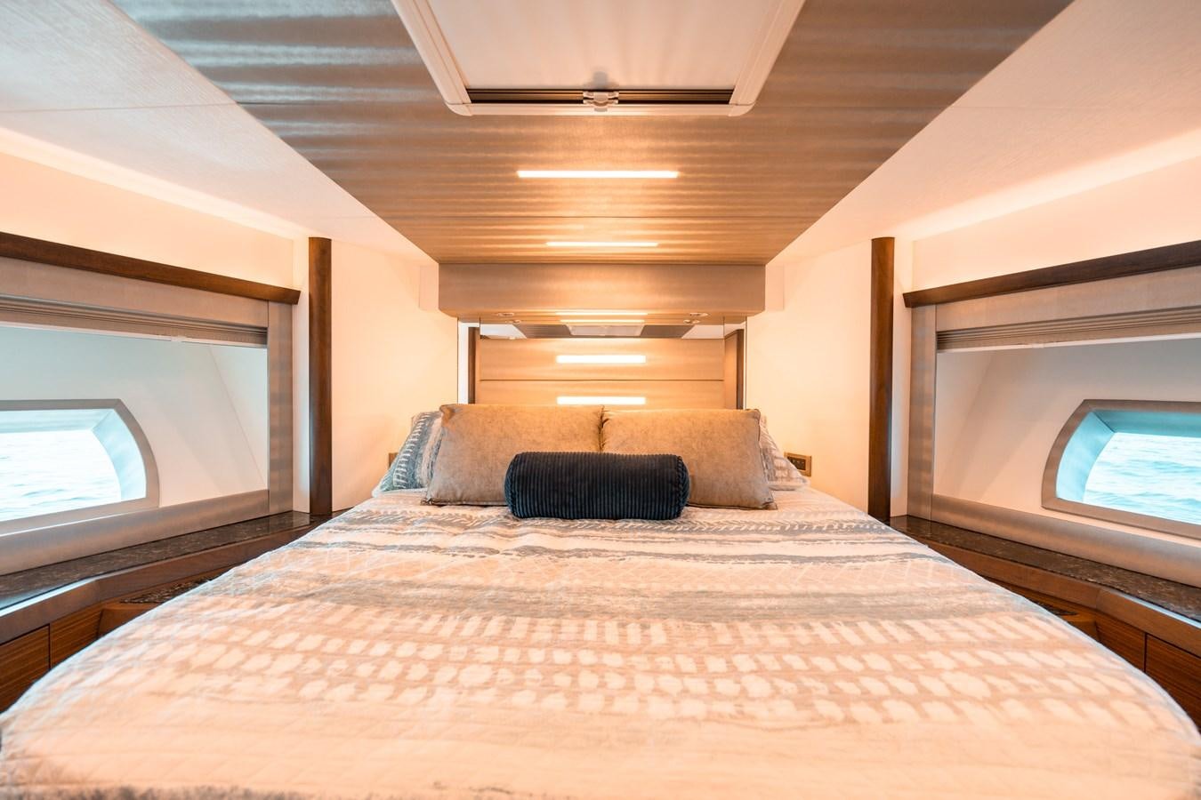 a bed with a pillow on it aboard THE THREE B'S Yacht for Sale