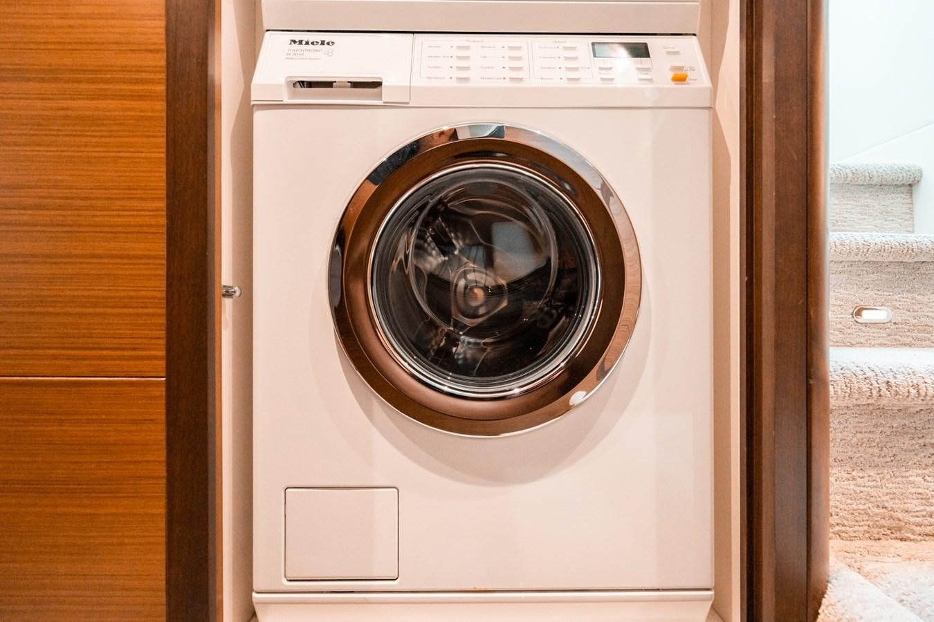 a white washing machine aboard THE THREE B'S Yacht for Sale