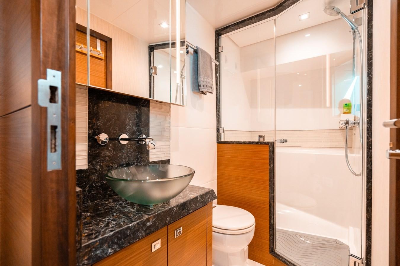 a bathroom with a sink and toilet aboard THE THREE B'S Yacht for Sale
