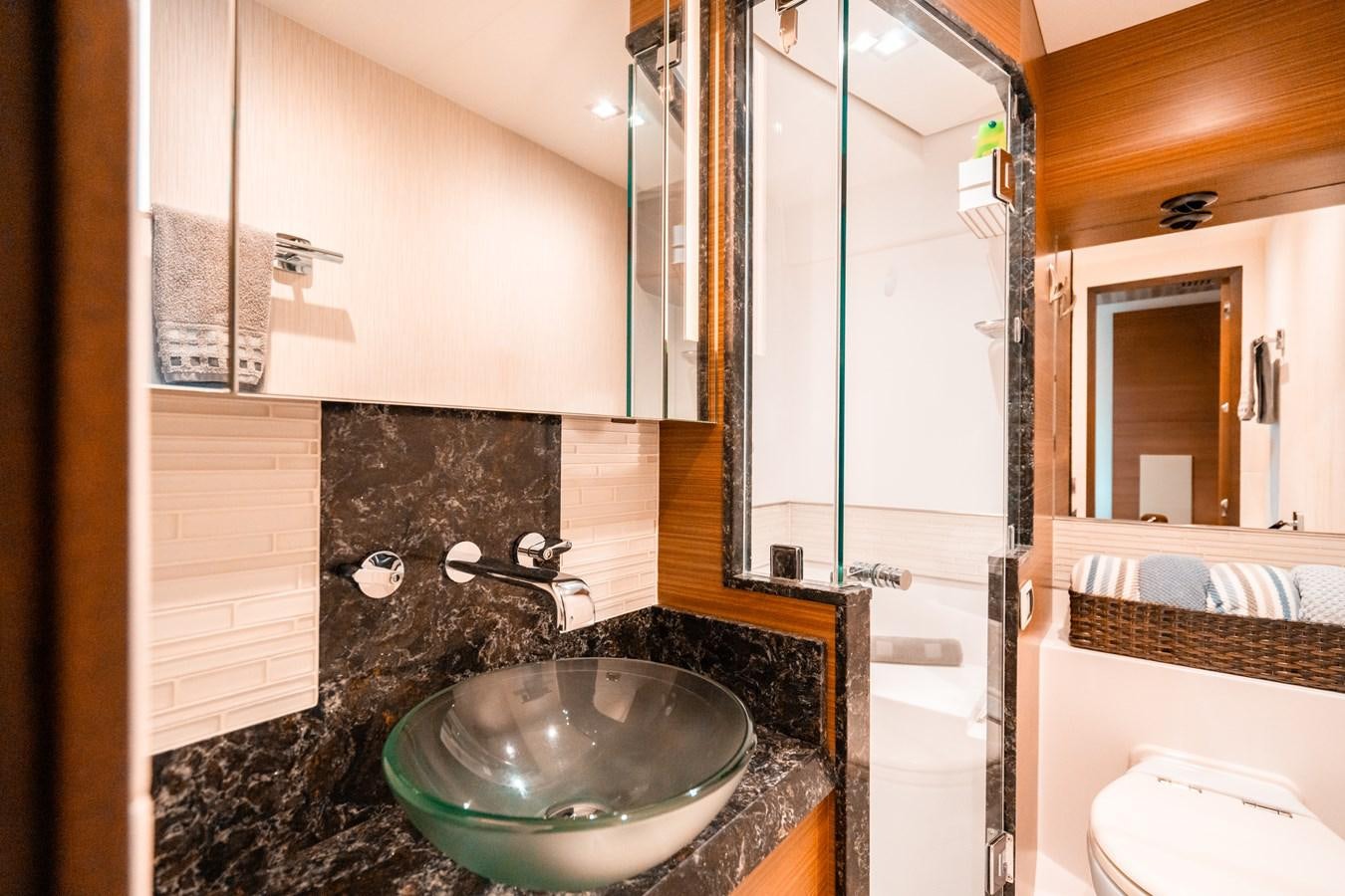 a bathroom with a round sink aboard THE THREE B'S Yacht for Sale