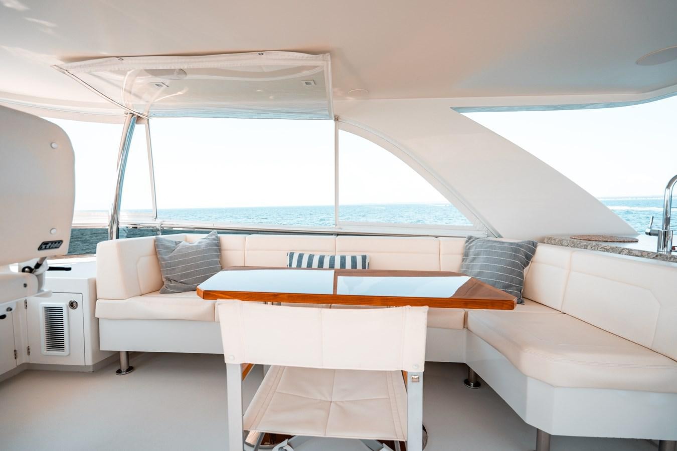 a room with a bed and a table aboard THE THREE B'S Yacht for Sale