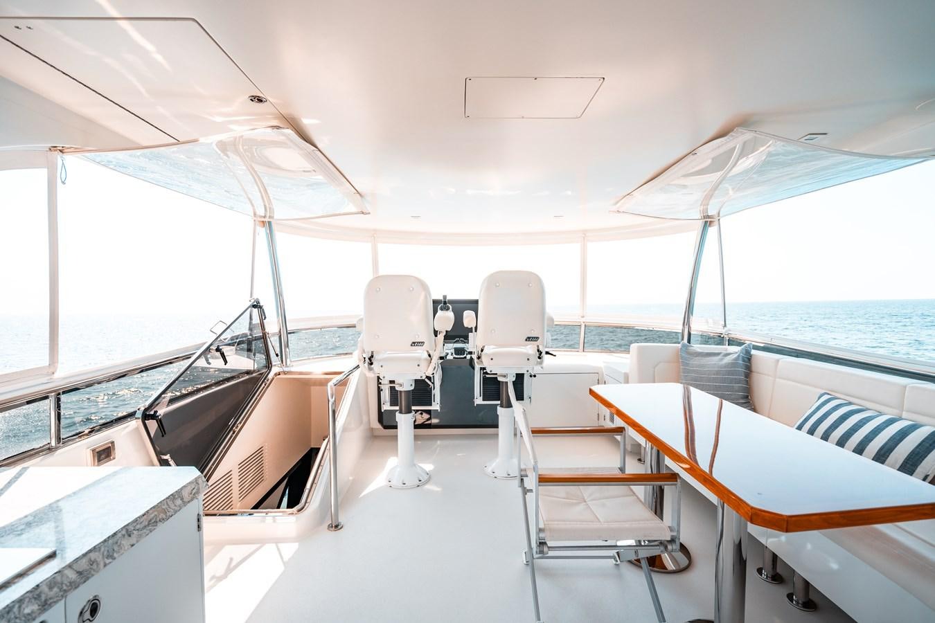 a boat with chairs and tables aboard THE THREE B'S Yacht for Sale