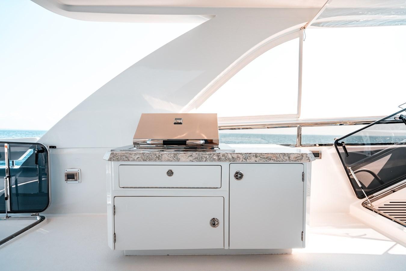 a white rectangular object with a brown box on top aboard THE THREE B'S Yacht for Sale