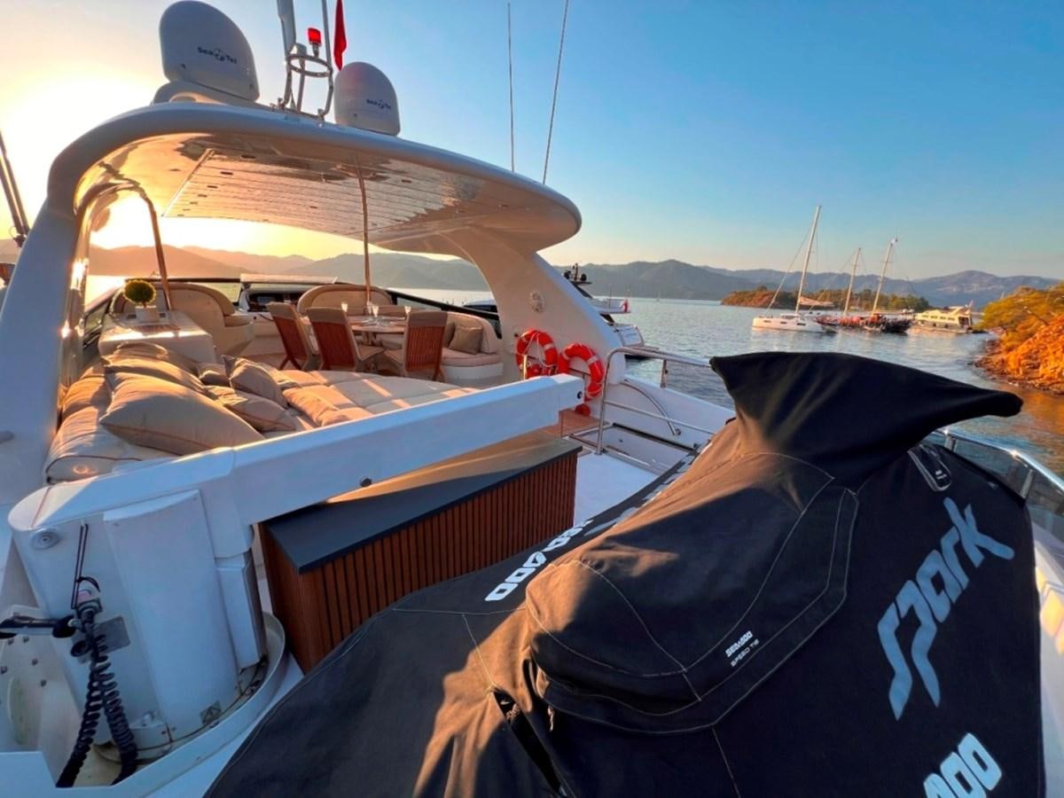 a boat with a cover on the front aboard MAIORA 26 Yacht for Sale
