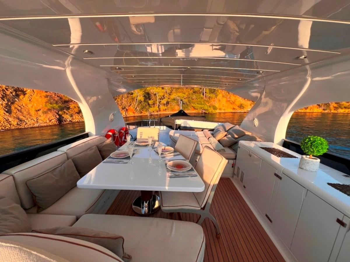 a modern kitchen with a large glass wall aboard MAIORA 26 Yacht for Sale