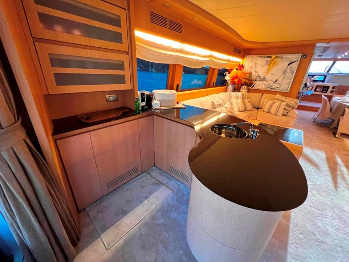 a kitchen with a sink and cabinets aboard MAIORA 26 Yacht for Sale