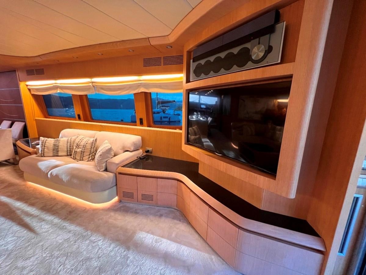 a room with a bed and a fireplace aboard MAIORA 26 Yacht for Sale