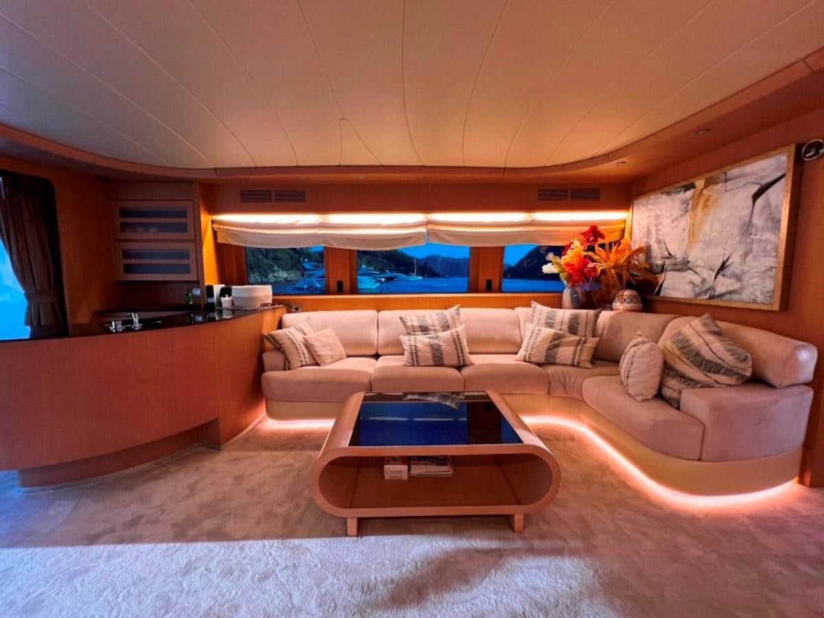 a living room with a couch and a coffee table aboard MAIORA 26 Yacht for Sale