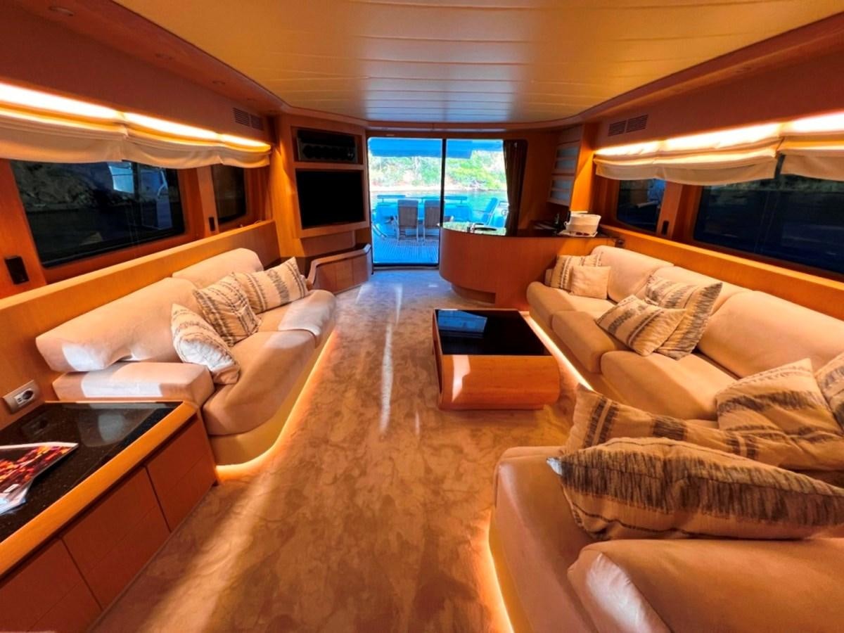 a living room with a large window aboard MAIORA 26 Yacht for Sale