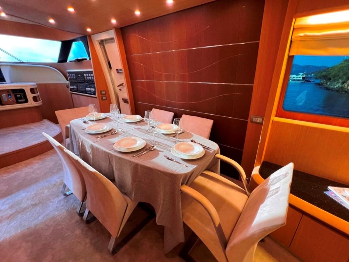 a table set for a meal aboard MAIORA 26 Yacht for Sale