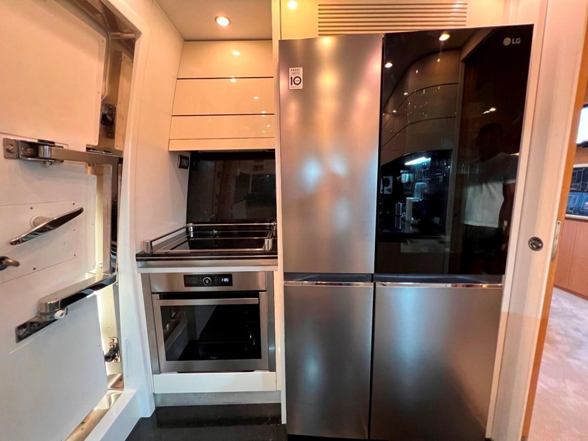a kitchen with stainless steel appliances aboard MAIORA 26 Yacht for Sale