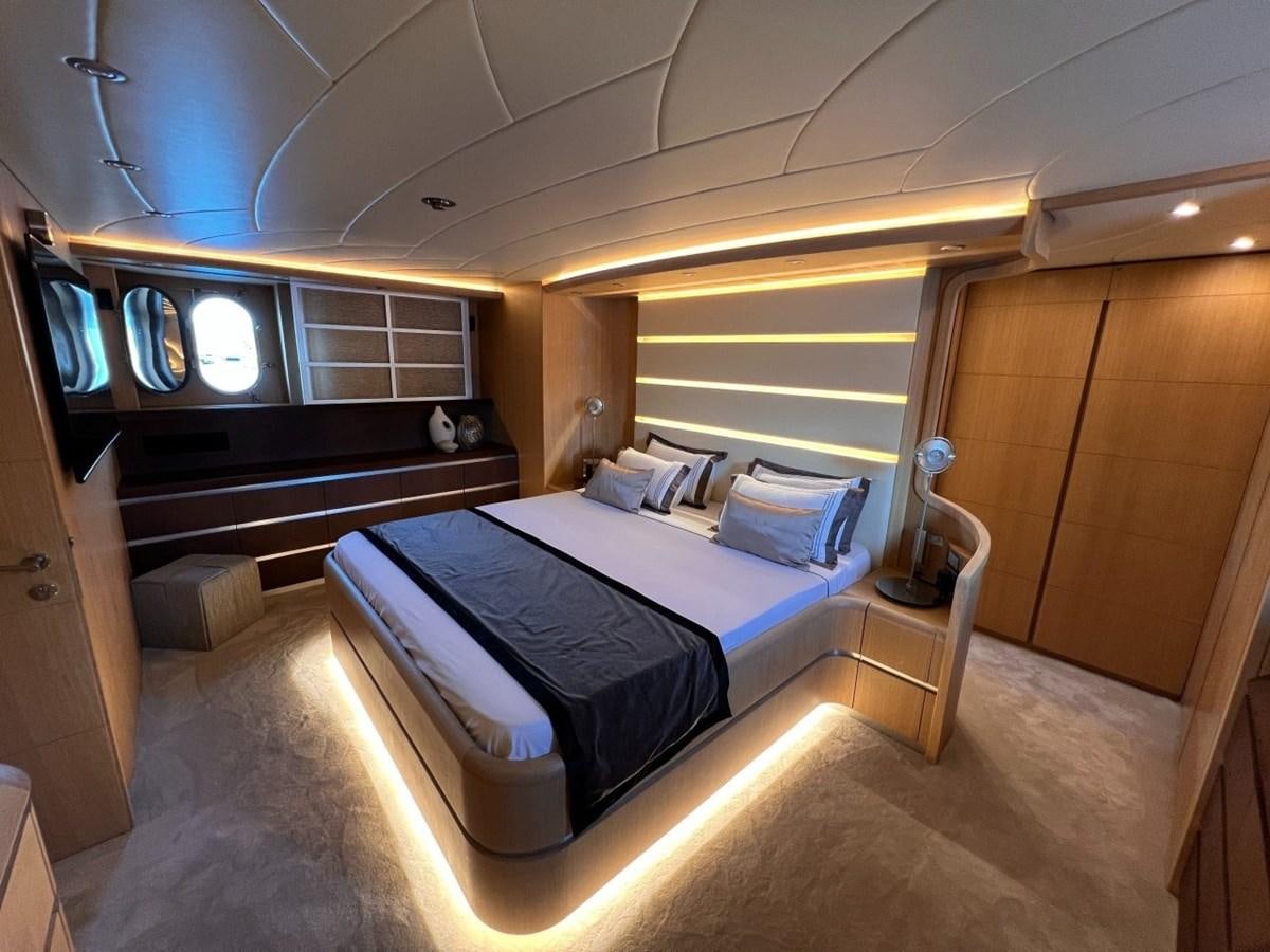 a room with a bed and a desk aboard MAIORA 26 Yacht for Sale