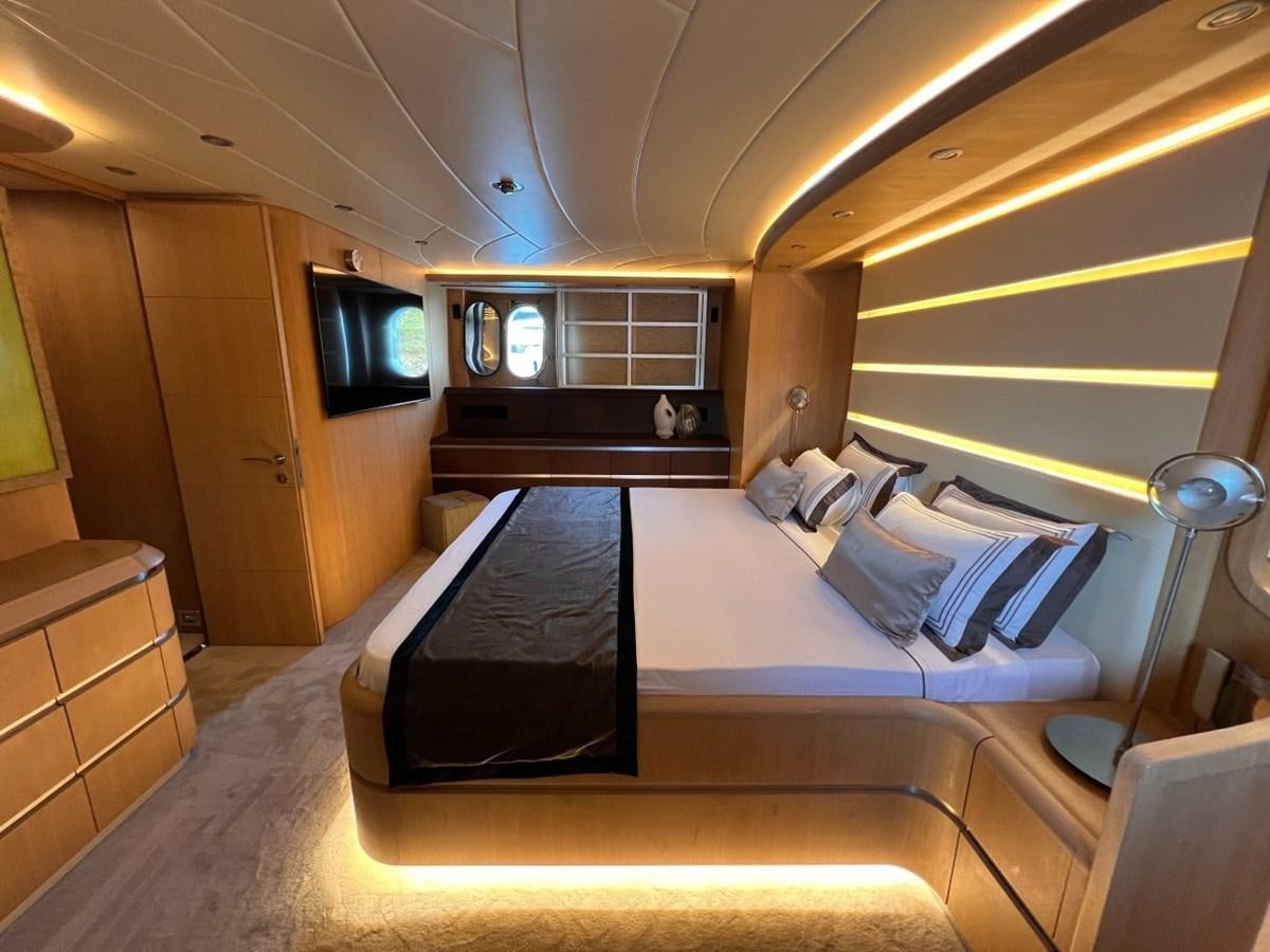 a room with a bed and a tv aboard MAIORA 26 Yacht for Sale