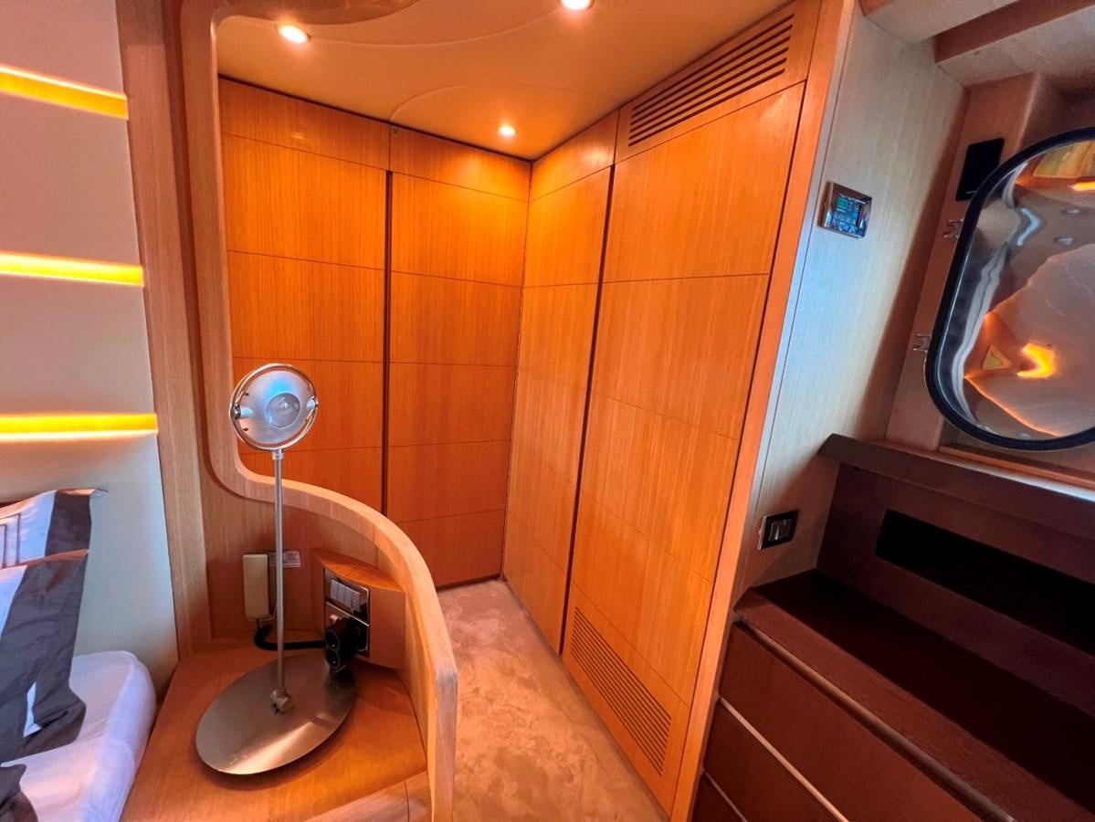 a room with a fan and a dresser aboard MAIORA 26 Yacht for Sale