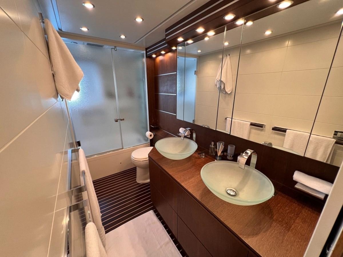 a bathroom with a sink and a mirror aboard MAIORA 26 Yacht for Sale