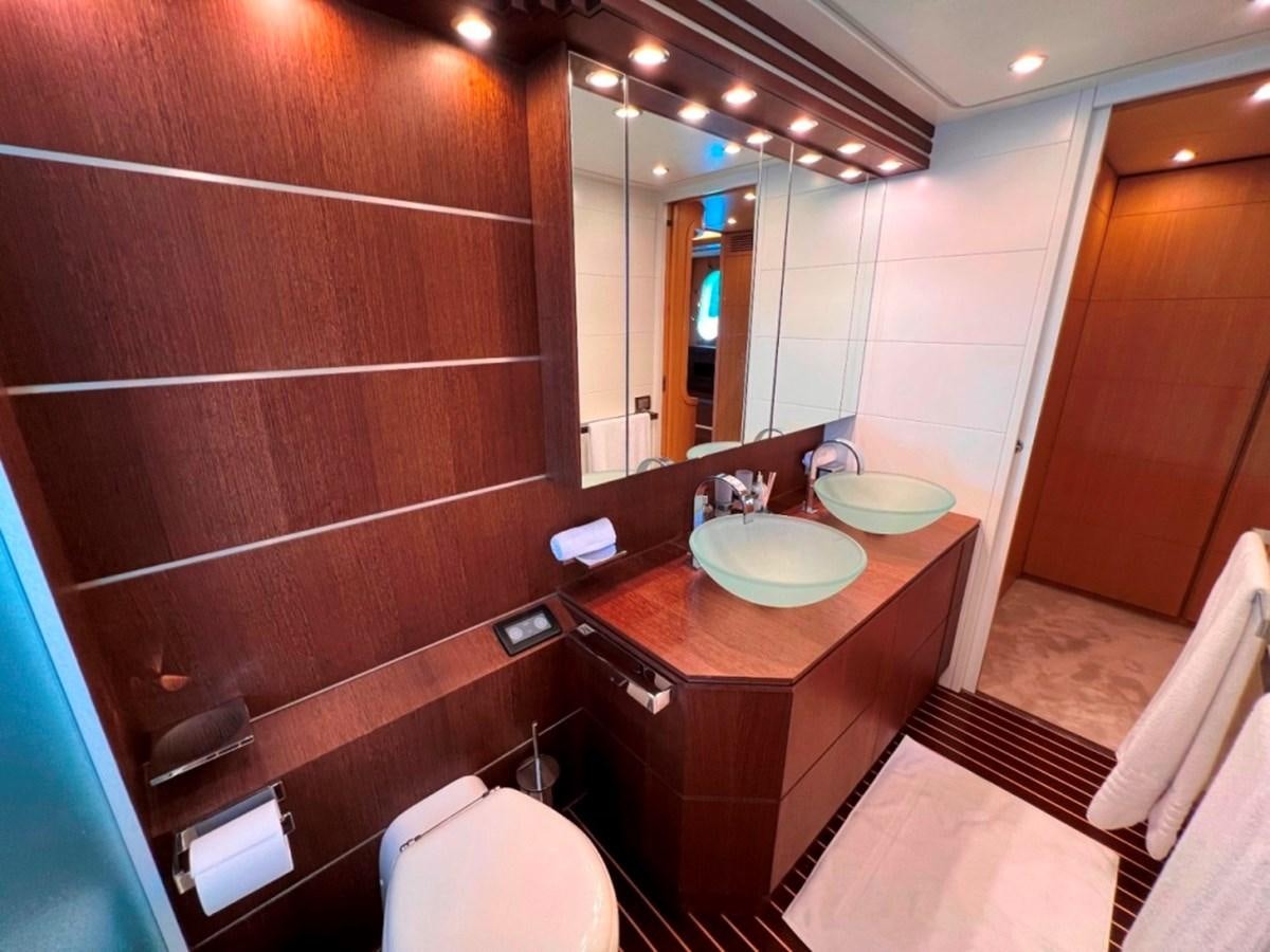 a bathroom with a sink and a mirror aboard MAIORA 26 Yacht for Sale
