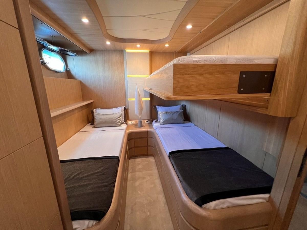 a room with bunk beds aboard MAIORA 26 Yacht for Sale