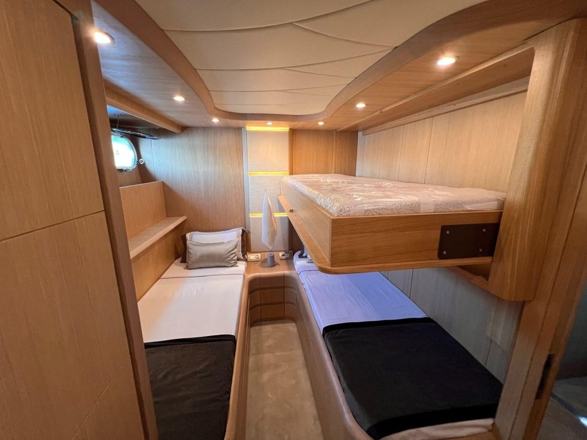 a room with a few beds aboard MAIORA 26 Yacht for Sale
