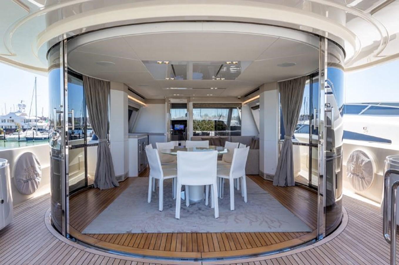 a room with a table and chairs aboard MIOTU 4 Yacht for Sale