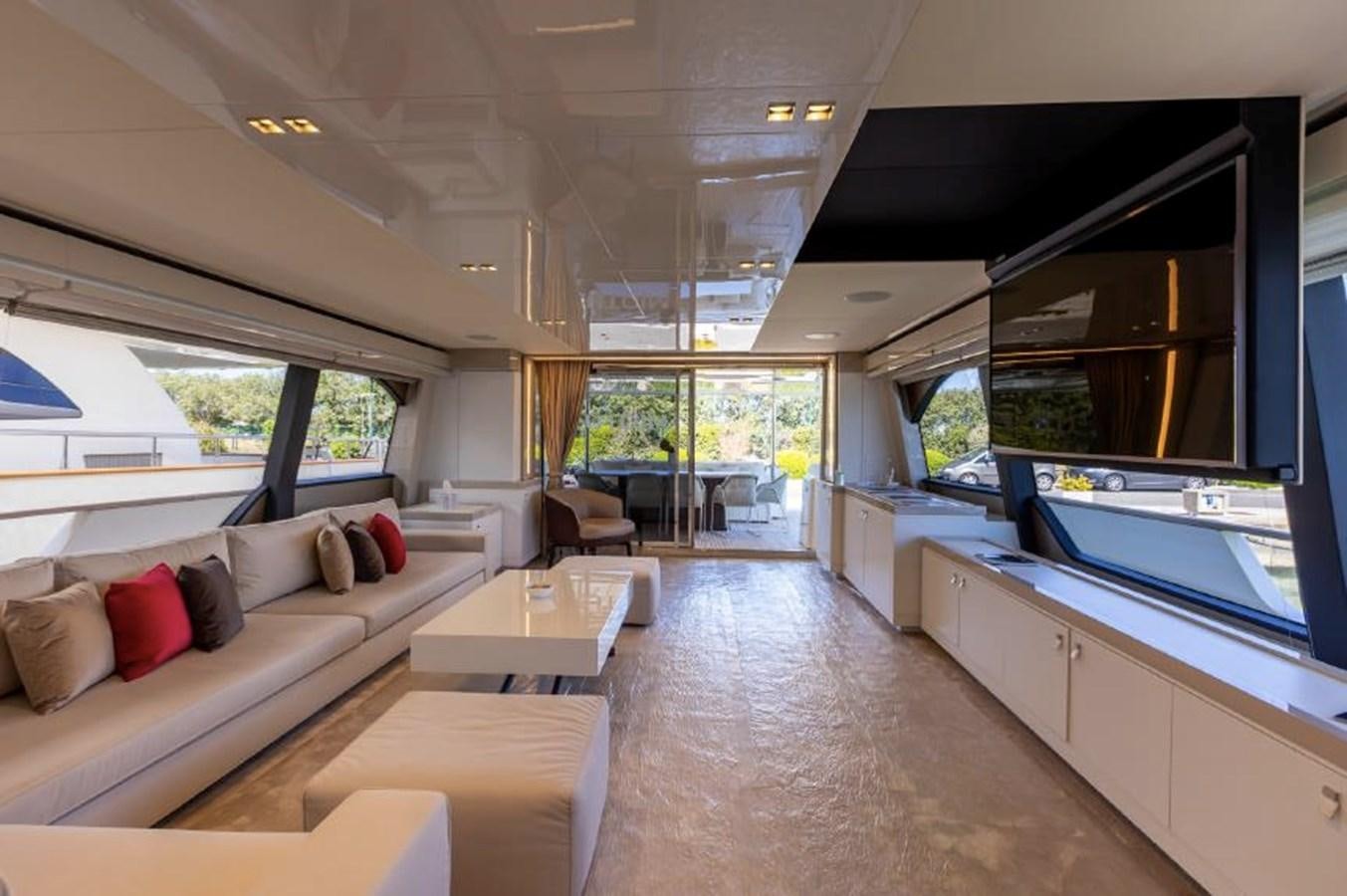 a living room with a large open window aboard MIOTU 4 Yacht for Sale