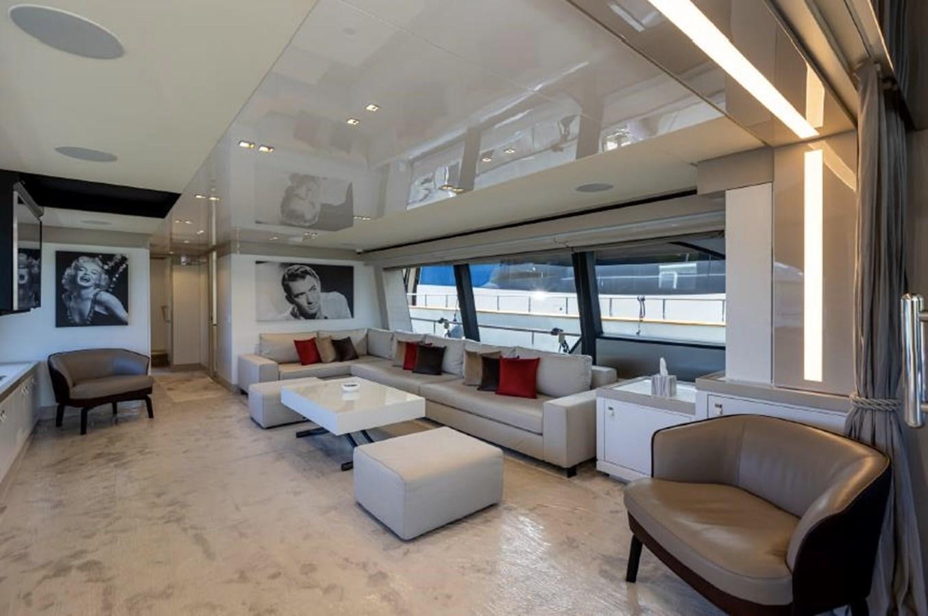 a living room with a large window aboard MIOTU 4 Yacht for Sale