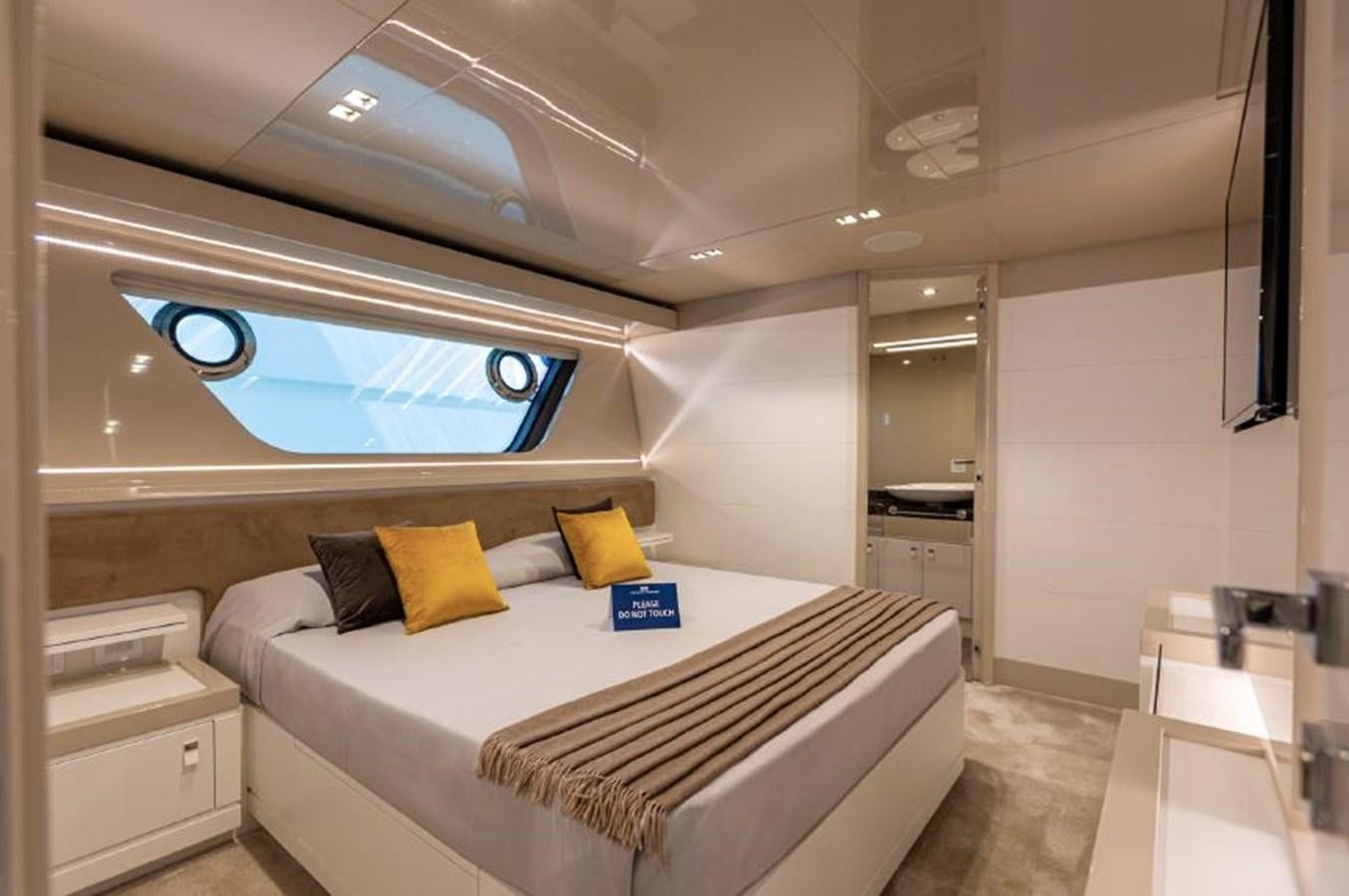a room with a bed and a window aboard MIOTU 4 Yacht for Sale