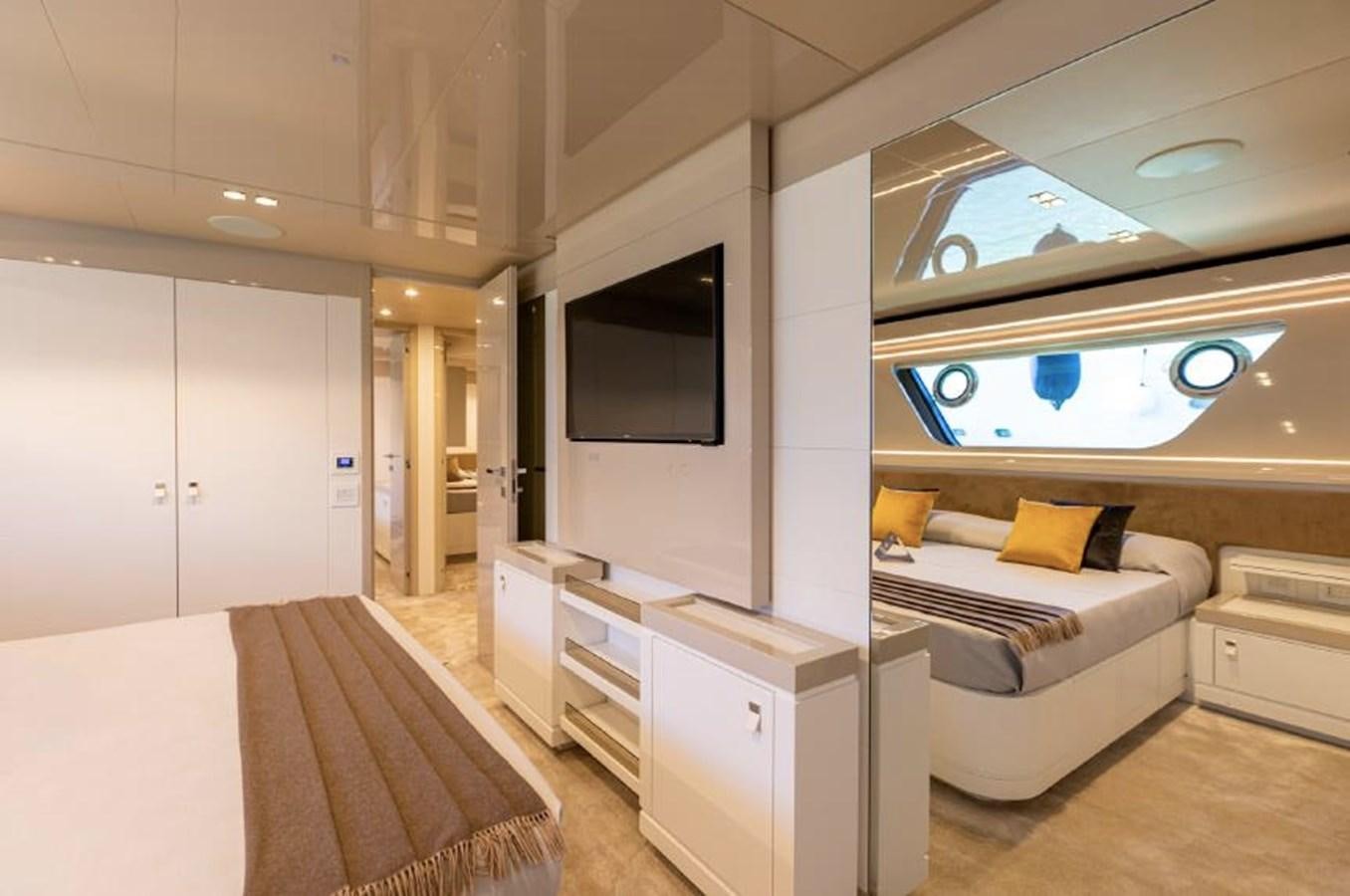 a room with a bed and a tv aboard MIOTU 4 Yacht for Sale
