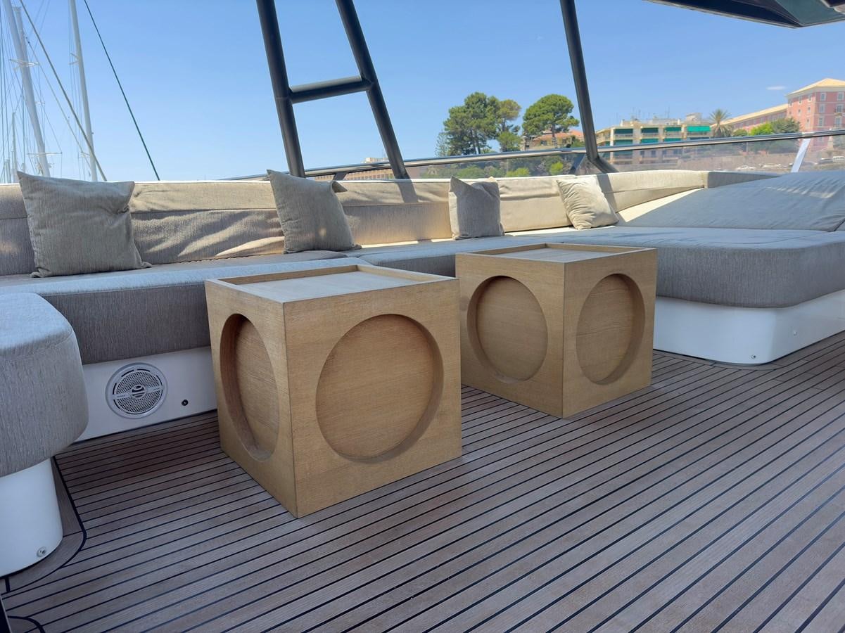 a wood deck with a large stack of blocks on it aboard TYCHE Yacht for Sale