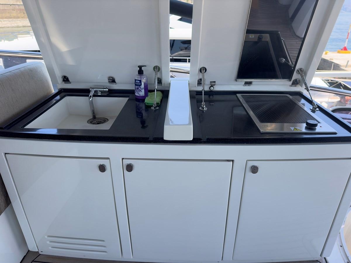 a kitchen with a sink and a window aboard TYCHE Yacht for Sale
