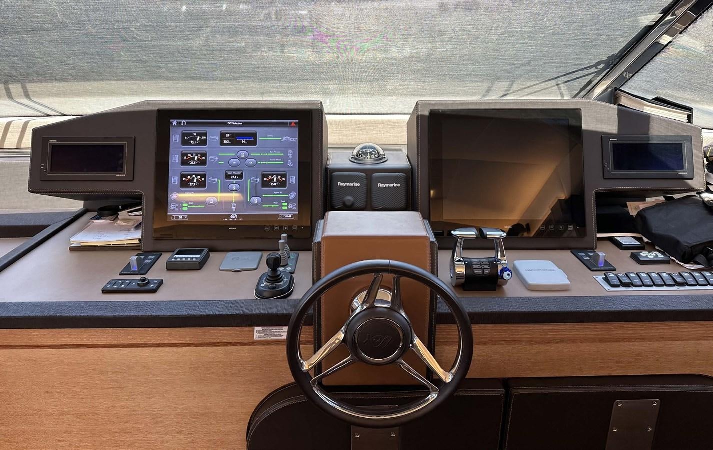 a computer desk with a camera and a monitor on it aboard TYCHE Yacht for Sale