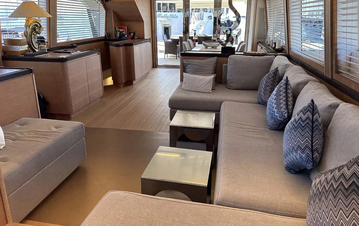 a living room with a couch and a coffee table aboard TYCHE Yacht for Sale