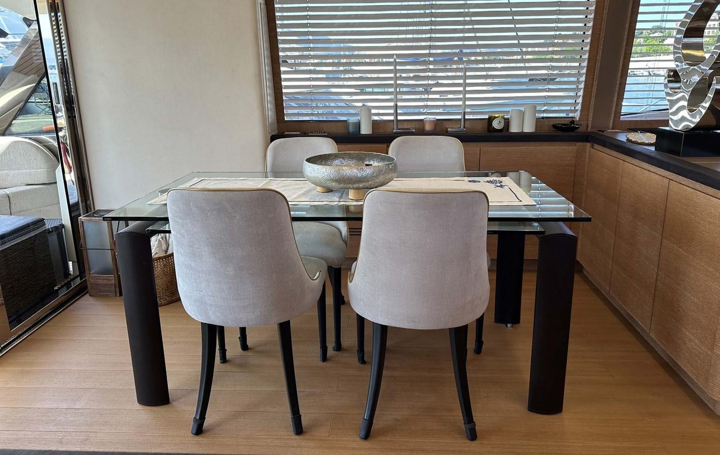 a table and chairs in a room aboard TYCHE Yacht for Sale