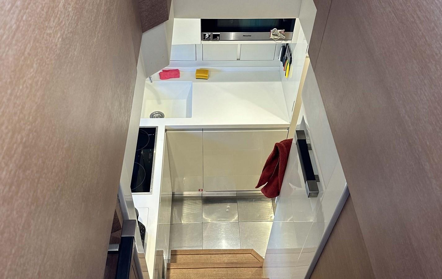 a kitchen with a tile floor aboard TYCHE Yacht for Sale