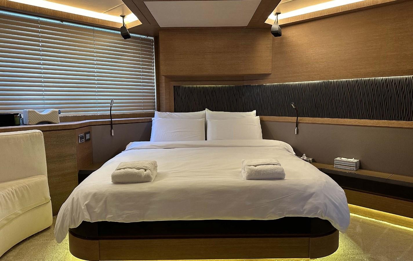 a bed with white pillows aboard TYCHE Yacht for Sale