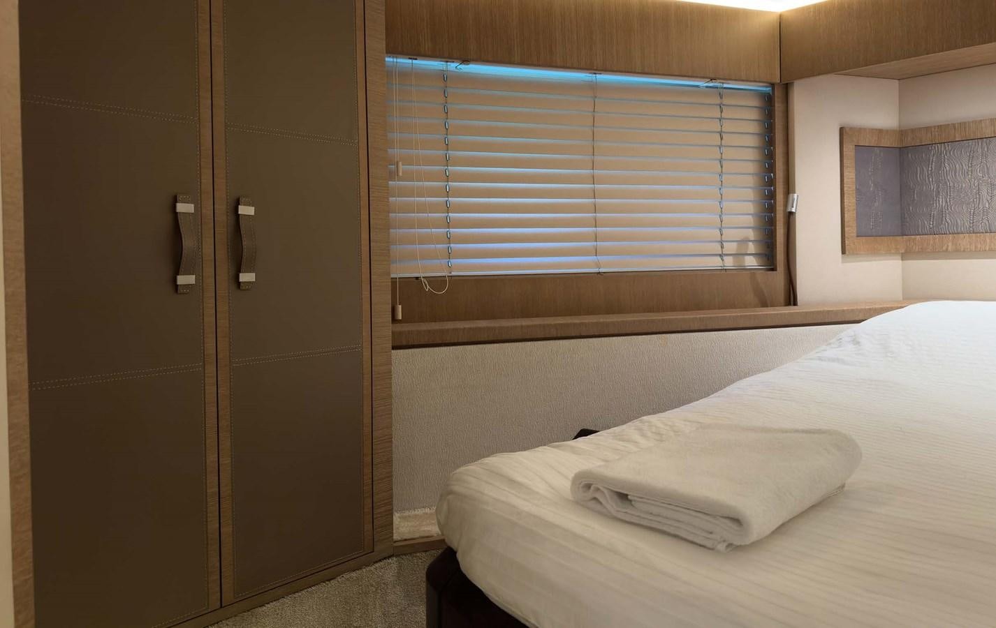 a bed with a white sheet aboard TYCHE Yacht for Sale