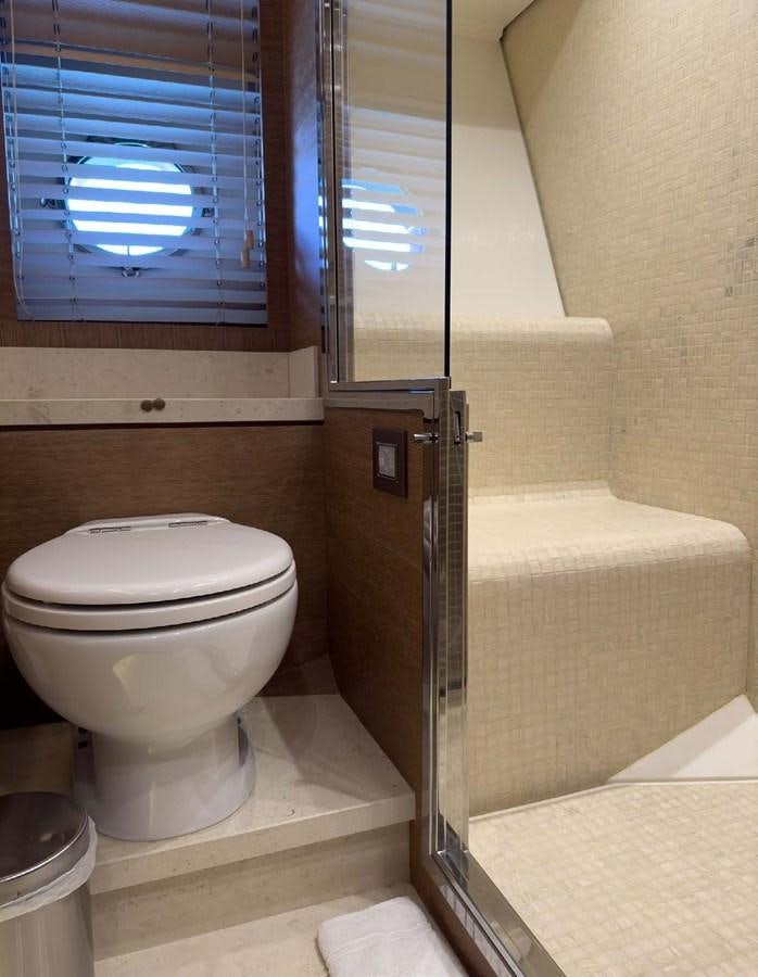 a bathroom with a toilet and a bathtub aboard TYCHE Yacht for Sale