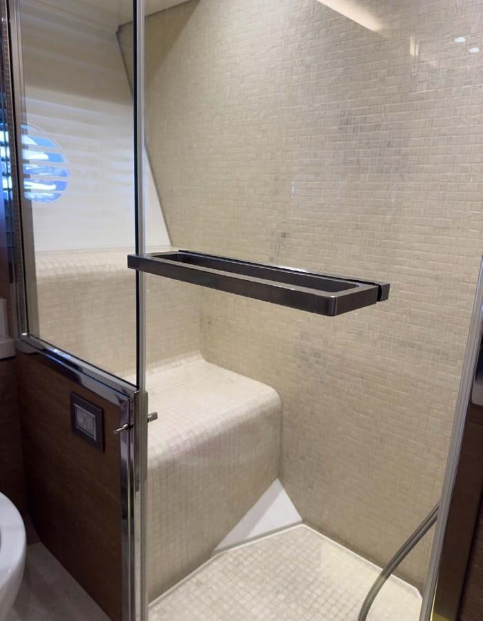 a bathroom with a glass shower aboard TYCHE Yacht for Sale