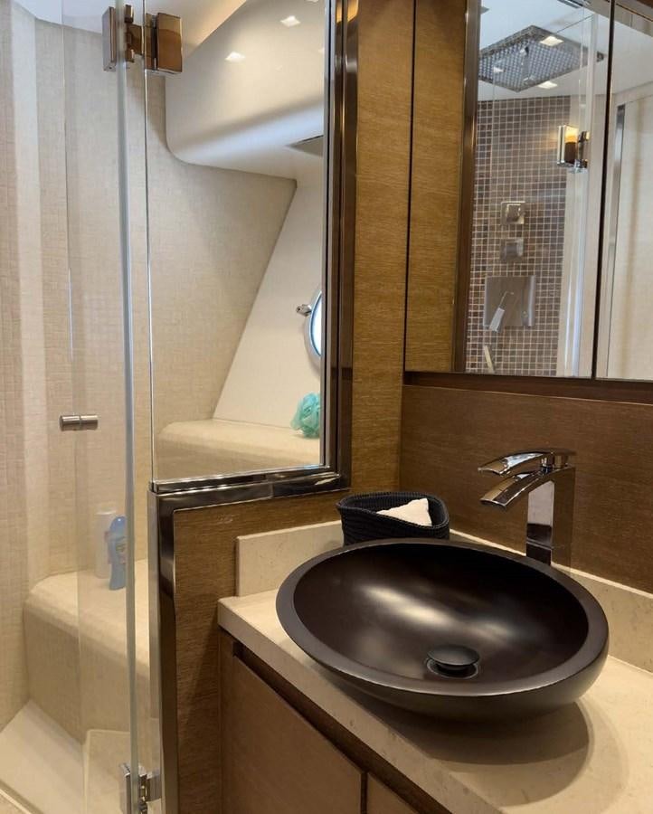 a bathroom with a sink and a mirror aboard TYCHE Yacht for Sale