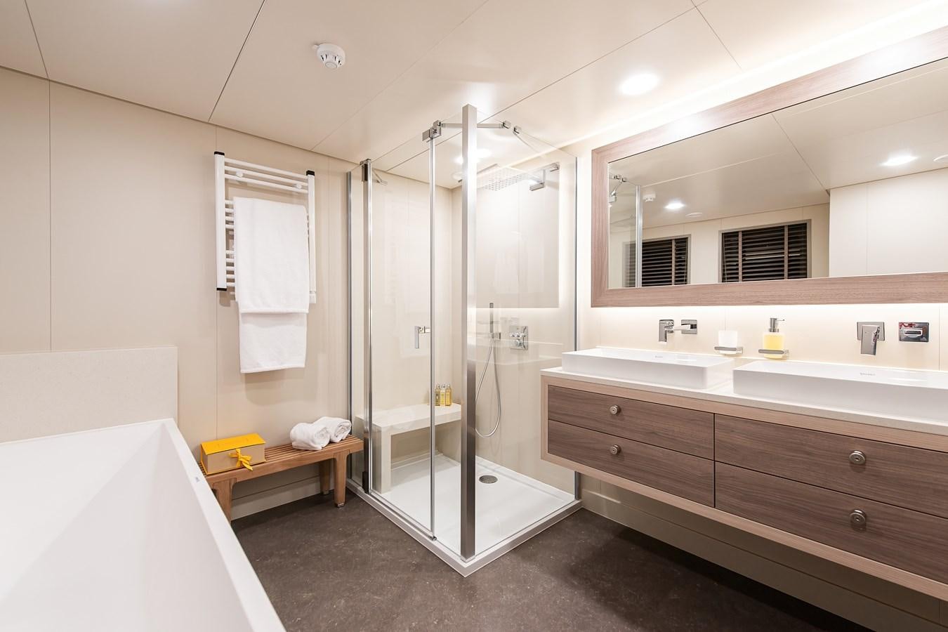 a bathroom with a shower and sink aboard FIVE OCEANS Yacht for Sale
