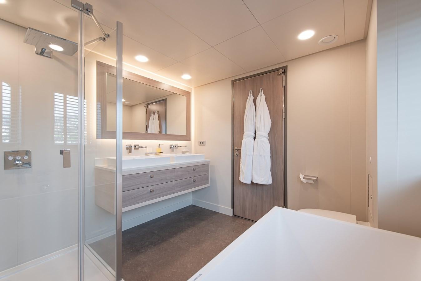 a bathroom with a glass shower aboard FIVE OCEANS Yacht for Sale