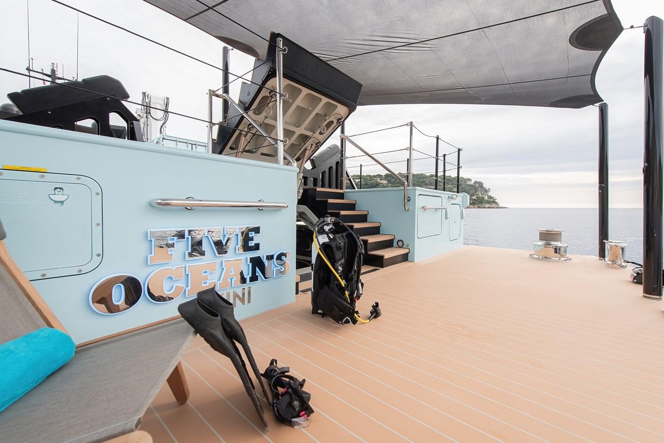 a boat on a deck aboard FIVE OCEANS Yacht for Sale