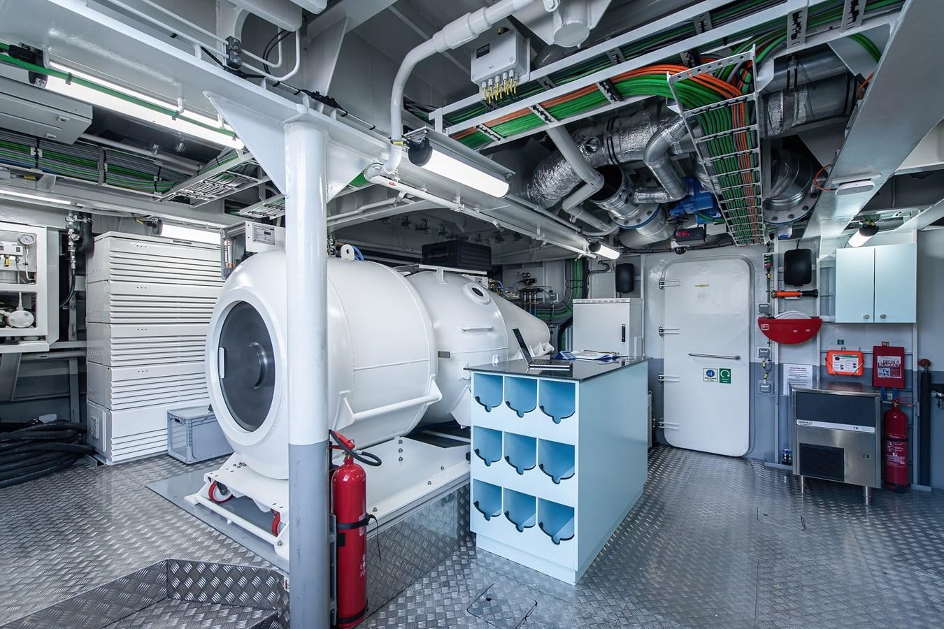 a large white machine in a factory aboard FIVE OCEANS Yacht for Sale
