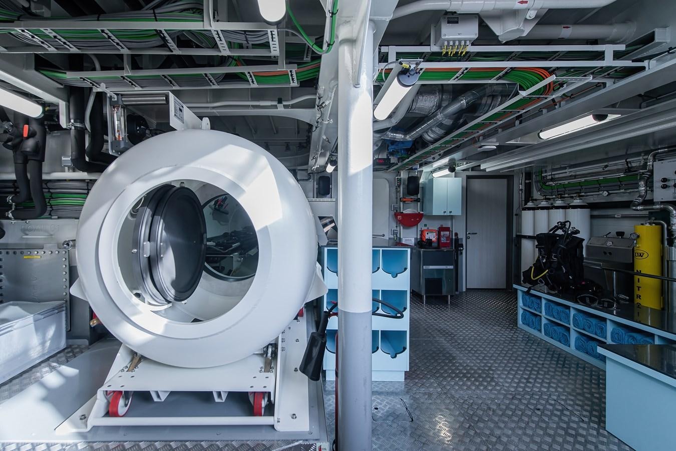 a large white machine in a factory aboard FIVE OCEANS Yacht for Sale