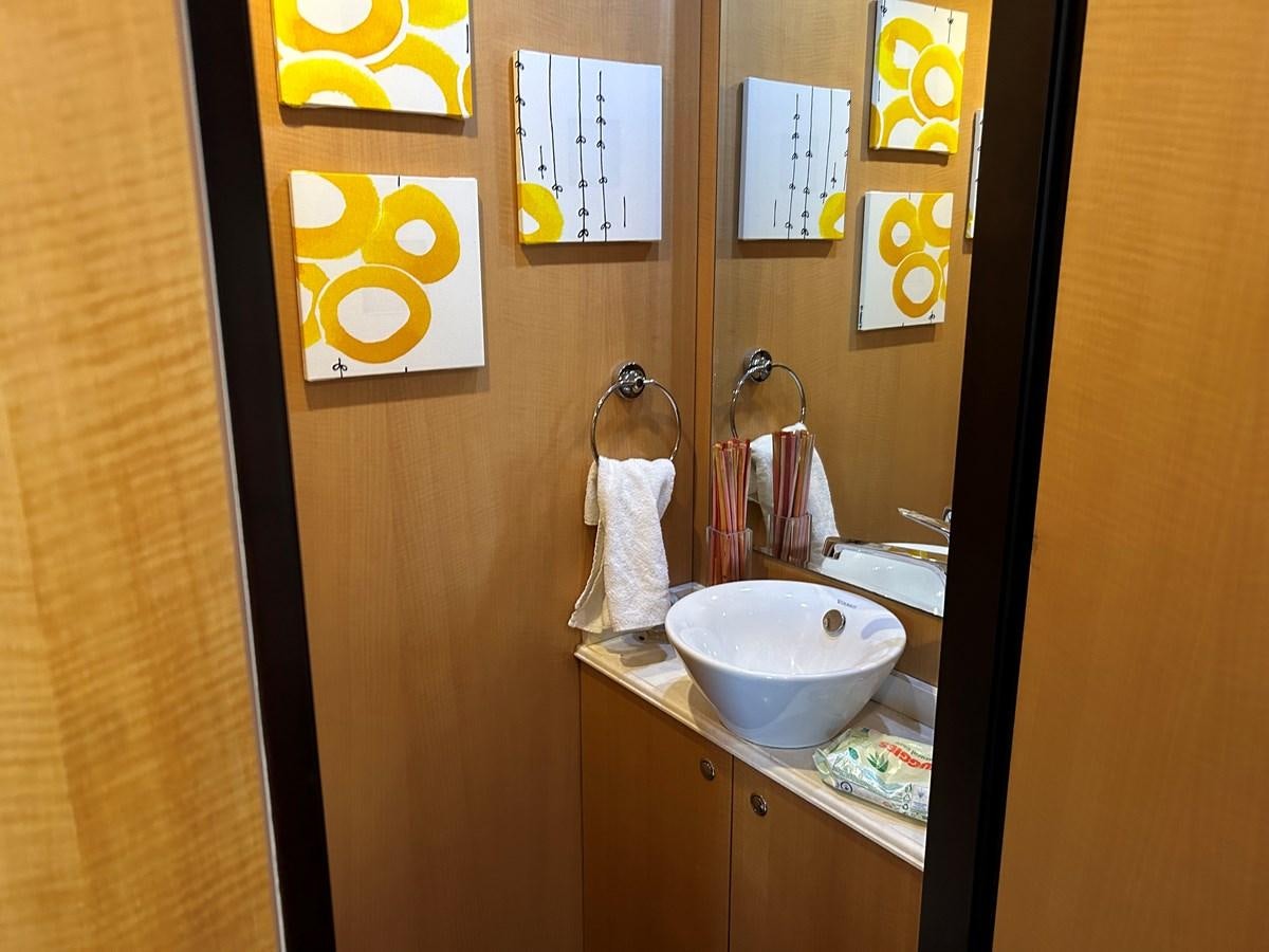 a bathroom with a sink and towels aboard WHISPER Yacht for Sale