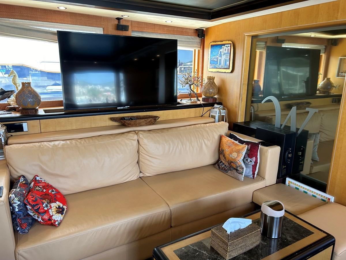a living room with a couch and a tv aboard WHISPER Yacht for Sale