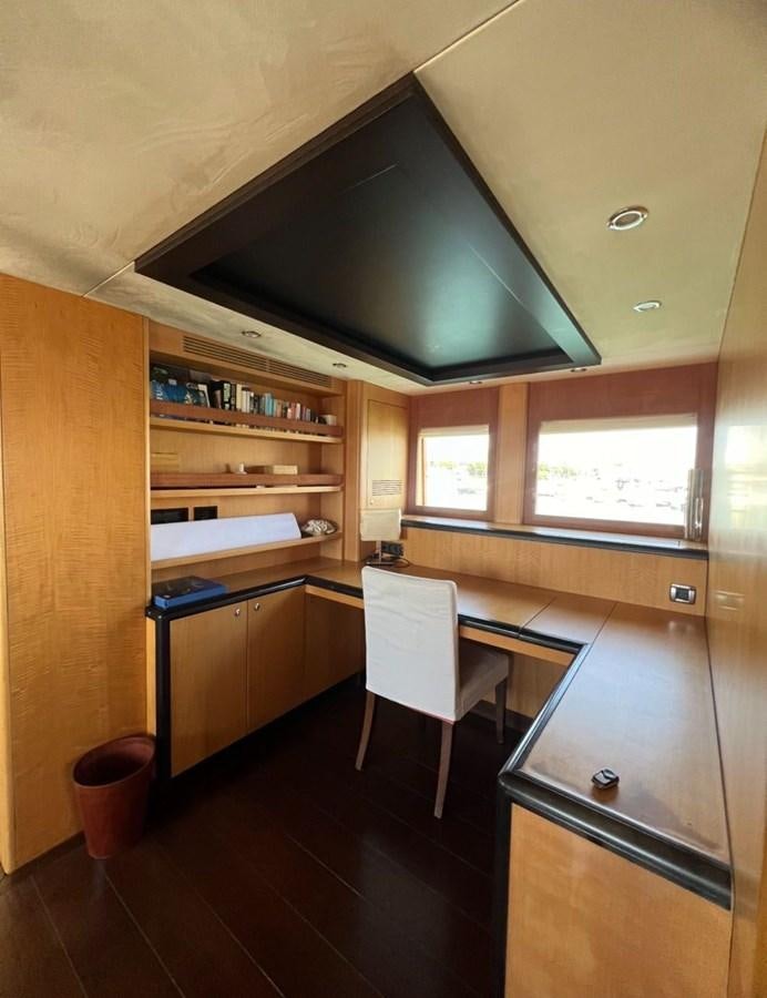 a kitchen with a bar and a table aboard WHISPER Yacht for Sale