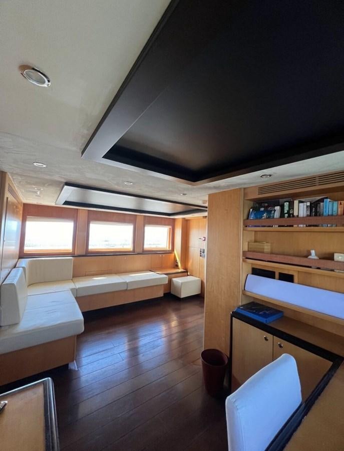 a room with a bed and a desk aboard WHISPER Yacht for Sale