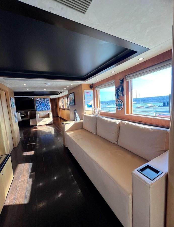 a room with a couch and a table aboard WHISPER Yacht for Sale