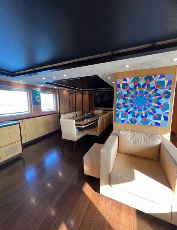 a room with a large painting on the wall aboard WHISPER Yacht for Sale
