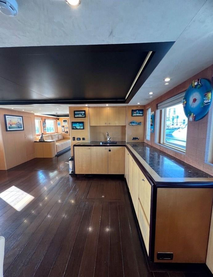 a kitchen with wooden floors aboard WHISPER Yacht for Sale